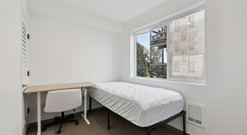 a room with a bed and a chair