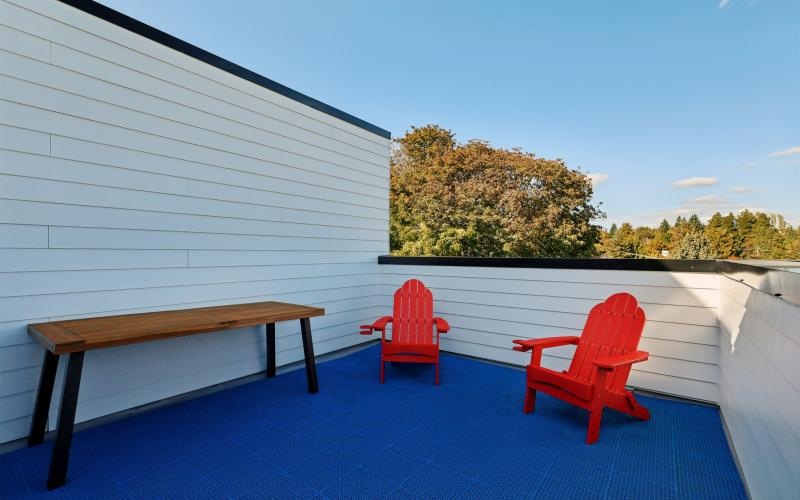 a couple of chairs on a deck