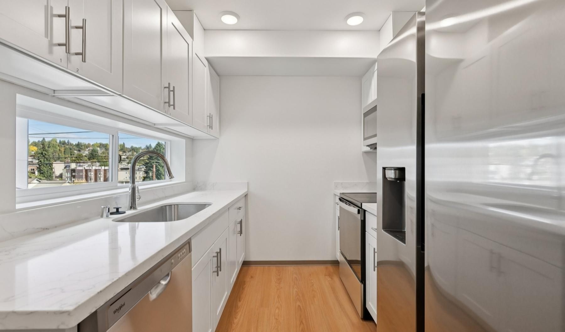 a kitchen with white cabinets