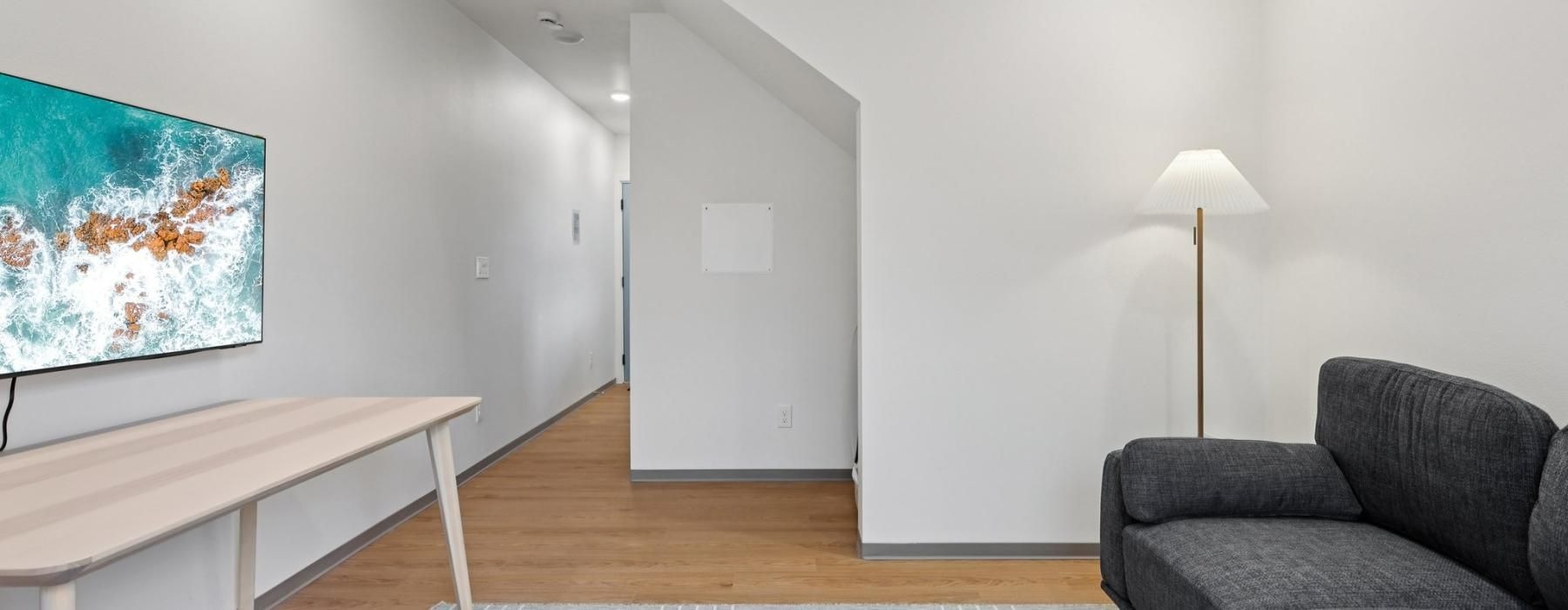 a living room with a couch and a table